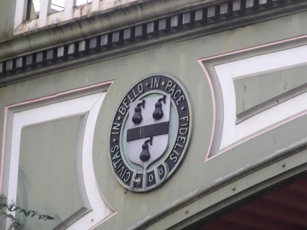The railway bridge at Worcester Foregate Street station, carrying the city's Black Pear shield